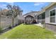 Picturesque backyard featuring a well-manicured lawn, privacy fence, screened porch, and a gazebo at 3968 Hanoverian Dr, Mount Pleasant, SC 29429