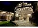 Relaxing backyard patio with outdoor seating, a grill, and overhead lighting for evening enjoyment at 3968 Hanoverian Dr, Mount Pleasant, SC 29429