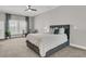 Comfortable bedroom features a queen-sized bed with a gray headboard and decorative pillows at 3968 Hanoverian Dr, Mount Pleasant, SC 29429