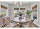 Bright dining room with round table, stylish seating, and natural light from surrounding windows at 3968 Hanoverian Dr, Mount Pleasant, SC 29429