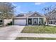 Charming brick home with well-maintained lawn, mature trees, and a two-car garage at 3968 Hanoverian Dr, Mount Pleasant, SC 29429