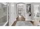 Inviting hallway features wood floors, neutral walls, and arched entryway to an open-concept living space at 3968 Hanoverian Dr, Mount Pleasant, SC 29429