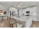 Bright white kitchen boasts a large island with seating and stainless steel appliances at 3968 Hanoverian Dr, Mount Pleasant, SC 29429