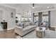 Inviting living room, showcases stylish furnishings, with an open view into the modern kitchen at 3968 Hanoverian Dr, Mount Pleasant, SC 29429