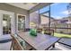 Covered screened-in patio with comfortable seating, offering a tranquil outdoor living space at 3968 Hanoverian Dr, Mount Pleasant, SC 29429