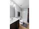 Well-lit bathroom featuring a vanity with a sink, a toilet, and a shower-tub combination at 408 Branch Creek Trl, Summerville, SC 29483
