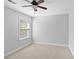 Clean and bright bedroom with neutral tones and a large window at 408 Branch Creek Trl, Summerville, SC 29483