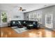 Comfortable living room featuring hardwood floors, a large sectional sofa, and plenty of natural light at 408 Branch Creek Trl, Summerville, SC 29483