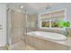 Bright bathroom with a shower and soaking tub, perfect for unwinding after a long day at 410 Ocean Oaks Ct, Kiawah Island, SC 29455