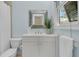 Bright bathroom featuring a new vanity, decorative mirror, and serene wall color at 410 Ocean Oaks Ct, Kiawah Island, SC 29455