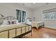 Charming bedroom with two beds, natural light and hardwood floors for a cozy retreat at 410 Ocean Oaks Ct, Kiawah Island, SC 29455