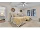 Cozy bedroom featuring two twin beds, ceiling fan and two windows with custom decor at 410 Ocean Oaks Ct, Kiawah Island, SC 29455