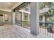 An outdoor patio with stone tile is surrounded by landscaping and pillars at 410 Ocean Oaks Ct, Kiawah Island, SC 29455