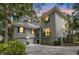Stunning two-story home with lush landscaping, garage, and inviting curb appeal at 410 Ocean Oaks Ct, Kiawah Island, SC 29455