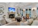 Bright and elegant living room showcasing stylish furniture, fireplace, and natural lighting at 410 Ocean Oaks Ct, Kiawah Island, SC 29455
