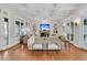 Elegant living room featuring coffered ceilings, a fireplace, and French doors at 410 Ocean Oaks Ct, Kiawah Island, SC 29455