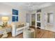 Relaxing living room with hardwood floors and decor with easy access to the bedroom and bathroom at 410 Ocean Oaks Ct, Kiawah Island, SC 29455