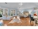Oversized primary bedroom with hardwood floors, French doors, and sitting area, perfect for relaxation at 410 Ocean Oaks Ct, Kiawah Island, SC 29455