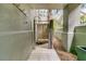 Private outdoor shower with wood planking and privacy screen offers a unique bathing experience at 410 Ocean Oaks Ct, Kiawah Island, SC 29455