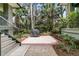 Outdoor patio area with barbecue, perfect for hosting gatherings and enjoying the surrounding greenery at 410 Ocean Oaks Ct, Kiawah Island, SC 29455