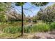 Scenic pond view with lush greenery showcases the tranquil setting of the property at 410 Ocean Oaks Ct, Kiawah Island, SC 29455