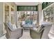 Relaxing porch with wicker furniture set and outdoor view, great for entertaining at 410 Ocean Oaks Ct, Kiawah Island, SC 29455
