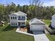 Charming two-story home and detached garage, set amidst lush greenery and mature trees at 4209 Royal Harbor Rd, Hollywood, SC 29449