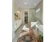 Sunlit bathroom featuring a glass shower, soaking tub, and stylish finishes at 4209 Royal Harbor Rd, Hollywood, SC 29449