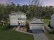 Beautiful two-story home featuring lush front yard and a detached garage at 4209 Royal Harbor Rd, Hollywood, SC 29449