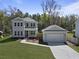 Charming two-story home and detached garage, set amidst lush greenery and mature trees at 4209 Royal Harbor Rd, Hollywood, SC 29449