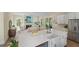 Bright kitchen features a quartz island and opens up to a cozy living area at 4209 Royal Harbor Rd, Hollywood, SC 29449