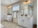 Modern bathroom featuring dual sinks, white cabinetry, and matte black hardware at 4310 Cotton Flat Rd, Summerville, SC 29485