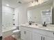 Bright bathroom with double sink vanity, bathtub, toilet, and large mirror at 4310 Cotton Flat Rd, Summerville, SC 29485