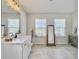 Bright bathroom with dual sinks, white cabinetry, sleek faucets and plenty of counter space at 4310 Cotton Flat Rd, Summerville, SC 29485