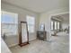 Bright bathroom with tile flooring, double windows, vanity and access to the main bedroom at 4310 Cotton Flat Rd, Summerville, SC 29485