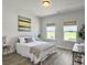 Comfortable bedroom with natural light, modern decor, and a serene view at 4310 Cotton Flat Rd, Summerville, SC 29485