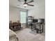 A bedroom with neutral-toned walls, a ceiling fan, and a desk setup with dual monitors, offering a modern and functional space at 4310 Cotton Flat Rd, Summerville, SC 29485