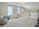 Bright, open bonus room featuring neutral paint, carpet flooring, and play space at 4310 Cotton Flat Rd, Summerville, SC 29485