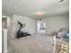 Bright bonus room featuring an elliptical machine, chair and natural light at 4310 Cotton Flat Rd, Summerville, SC 29485
