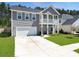Charming two-story home with a spacious driveway and manicured lawn at 4310 Cotton Flat Rd, Summerville, SC 29485