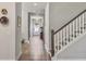 Hallway with hardwood floors, staircase access and easy access to all parts of the home at 4310 Cotton Flat Rd, Summerville, SC 29485