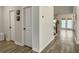Hallway with doors and view to backyard at 4310 Cotton Flat Rd, Summerville, SC 29485