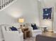 Cozy living room features hardwood floors, comfortable chairs and natural light from large windows at 4310 Cotton Flat Rd, Summerville, SC 29485