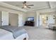 Open main bedroom with media center, sitting area, and access to the en-suite bathroom at 4310 Cotton Flat Rd, Summerville, SC 29485