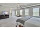 Large main bedroom featuring a ceiling fan, sitting area, TV console, and neutral carpeting at 4310 Cotton Flat Rd, Summerville, SC 29485