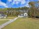 Aerial view of a home with a large yard and mature trees at 4332 John Hatch Dr, Johns Island, SC 29455