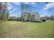 Expansive backyard with a well-maintained lawn and charming screened porch of the house at 4332 John Hatch Dr, Johns Island, SC 29455