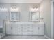 Bright bathroom with double vanity, modern lighting, and tiled walk-in shower at 4332 John Hatch Dr, Johns Island, SC 29455