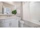 Bright white bathroom with modern fixtures, a shower-tub combo, and a plant accent at 4332 John Hatch Dr, Johns Island, SC 29455