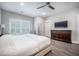 Modern bedroom featuring hardwood floors, neutral walls, and a TV at 4332 John Hatch Dr, Johns Island, SC 29455